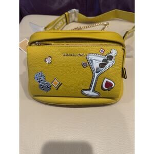 Michael Kors Slater medium sling pack yellow pebbled leather a casino theme